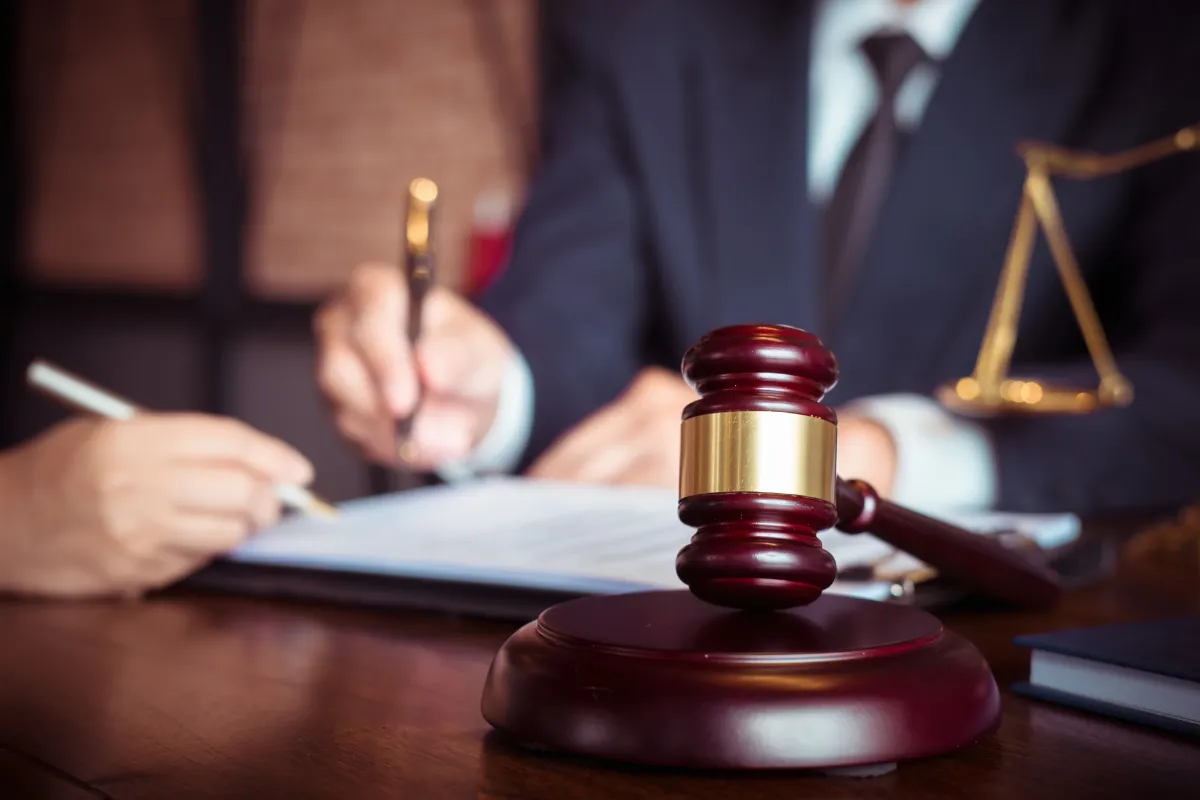 Consumer lawyers in Bangalore drafting a complaint, gavel and scales symbolizing consumer court justice.
